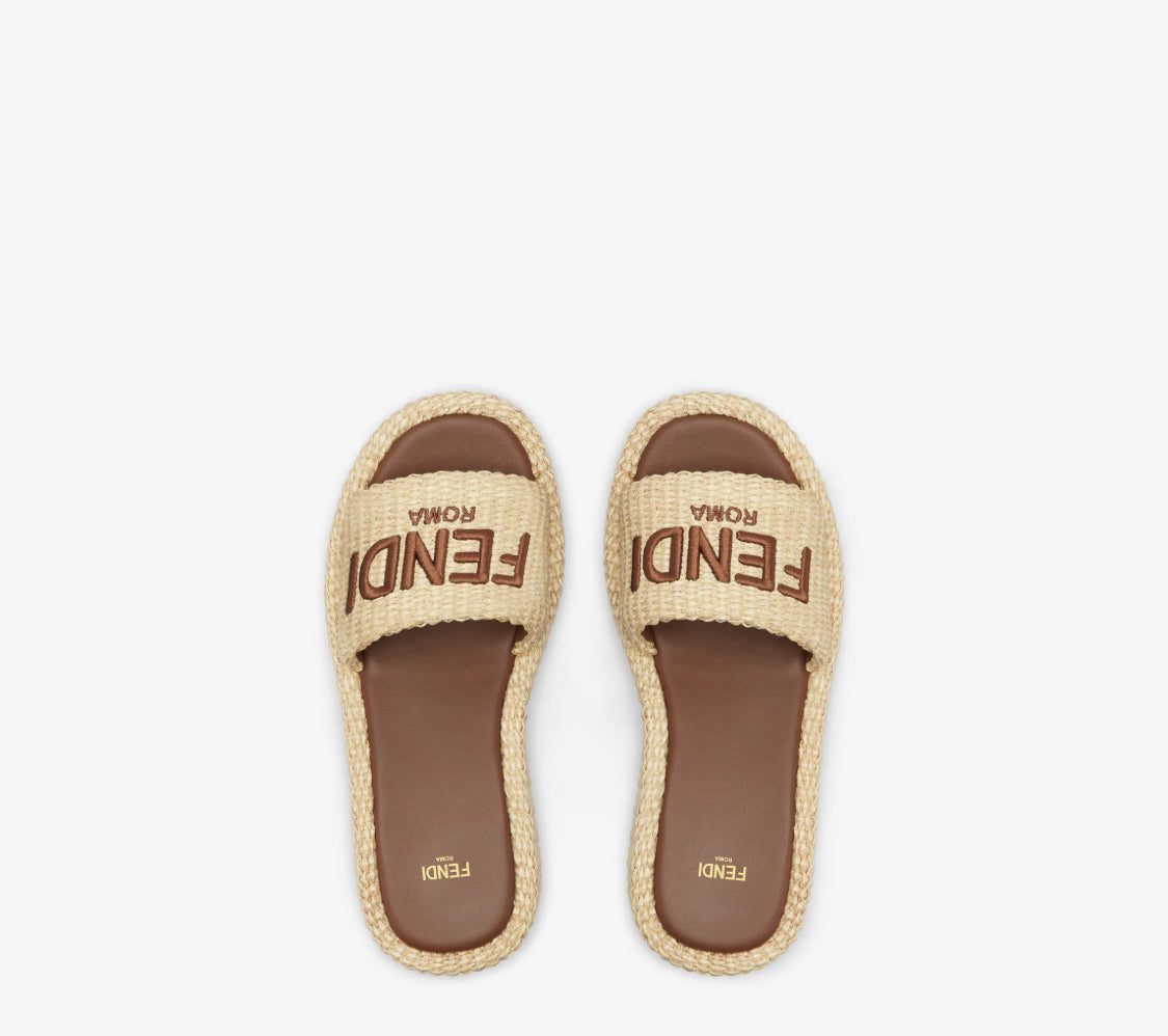 Fendi Sunshine
Beige cotton fiber flatform slides size 10.5