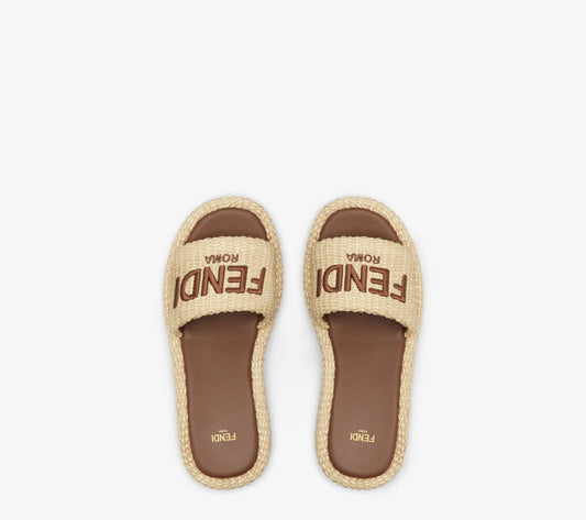 Fendi Sunshine
Beige cotton fiber flatform slides size 10.5